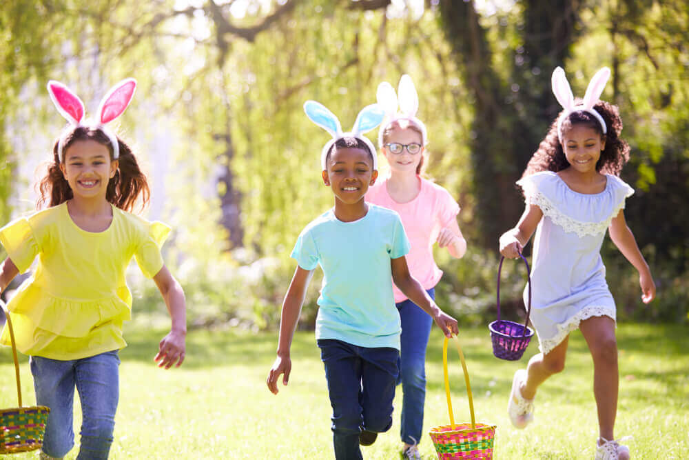 Kids running to find eggs during an Easter egg hunt