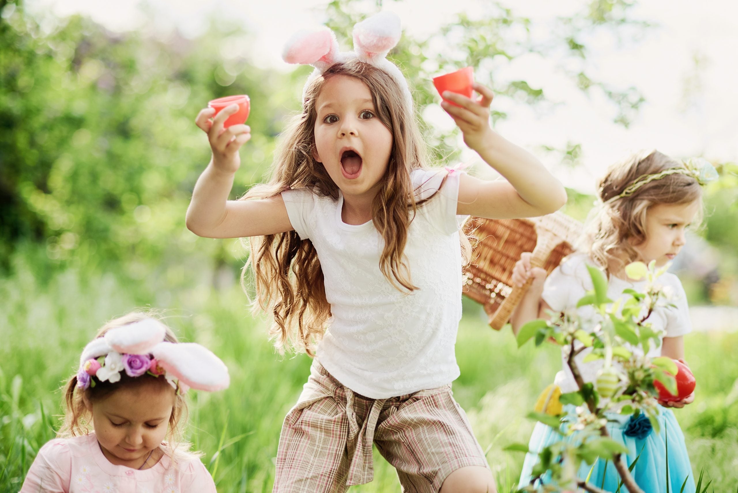 Image of kids hunting plastic Easter Eggs.