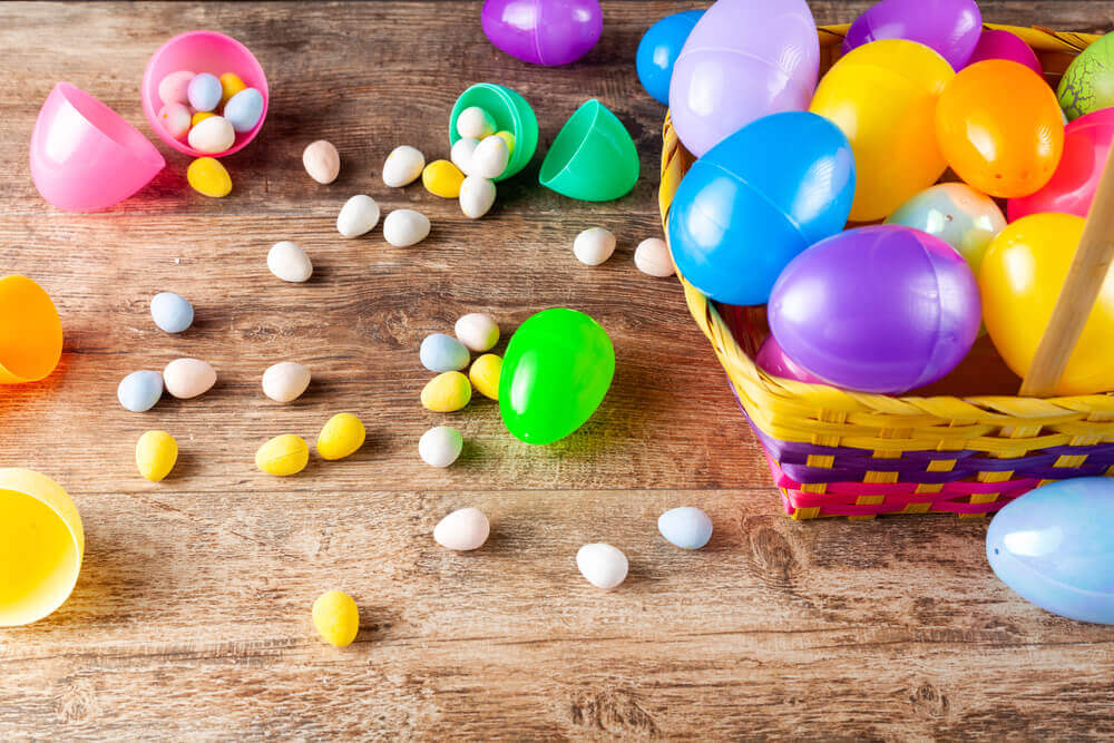 Plastic Easter eggs and candy on a table
